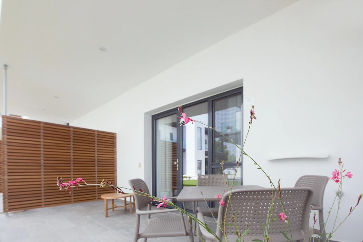 Private garden patio seating area in apartment at Suites Sole, Keramoti Greece